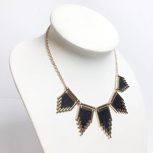 Brass necklace with black faux leather accents